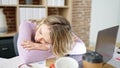 Young blonde woman business worker tired sleeping at office Royalty Free Stock Photo