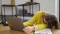 Young blonde woman business worker tired sleeping on table at office Royalty Free Stock Photo