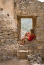 Young blonde woman contemplating the majestic view. Tourist in Sicily, Italy .
