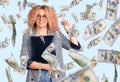 Young blonde woman with curly hair holding business folder surprised with an idea or question pointing finger with happy face, Royalty Free Stock Photo