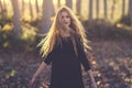 Young blonde woman dancing in poplar forest Royalty Free Stock Photo