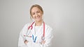 Young blonde woman doctor smiling confident standing with arms crossed gesture over isolated white background Royalty Free Stock Photo