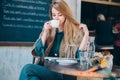 Young blonde woman drinking coffee cup background lifestule