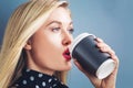 Young blonde woman drinking coffee Royalty Free Stock Photo