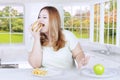Young blonde woman eats burger Royalty Free Stock Photo