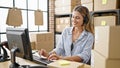 Young blonde woman ecommerce business agent having video call at office