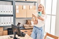 Young blonde woman ecommerce business worker make selfie by the smartphone at office Royalty Free Stock Photo