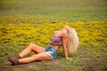 Young blonde woman in field