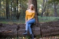 Young blonde woman in the forest, enjoying nature Royalty Free Stock Photo