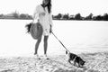 Woman Walking On The Beach With Kitten Royalty Free Stock Photo