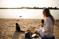 Blonde Woman On The Beach, Picnic With Kitten Royalty Free Stock Photo