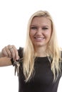 Young blonde woman is handing over keys