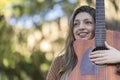 Young blonde woman with her guitar in the park. Concept of creative hobbiess and professionals. Positive attitude. Royalty Free Stock Photo