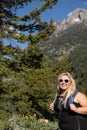 Young blonde woman hiker on the Bradley Lake trail wearing a backpack in Grand Teton National Park Wyoming Royalty Free Stock Photo
