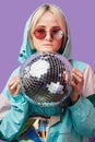 Beautiful lovely young Asian woman posing with silver discoball Royalty Free Stock Photo