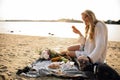 Blonde Woman On The Beach With Kitten Royalty Free Stock Photo