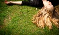 Young blonde woman lying on the grass. Royalty Free Stock Photo