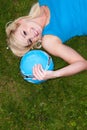 Young blonde woman lying on grass Royalty Free Stock Photo