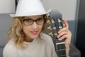 Young blonde woman playing the acoustic guitar Royalty Free Stock Photo