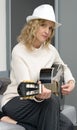 Young blonde woman playing the acoustic guitar Royalty Free Stock Photo