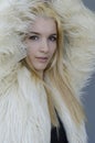 Young blonde Woman portrait with fur coat