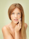 Young blonde woman removing makeup Royalty Free Stock Photo