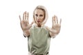 Young blonde woman shows hands with palms forward. Stop, no, protest. Isolated on white background. Fight for your rights