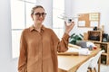 Young blonde woman smiling confident holding drone at architect studio Royalty Free Stock Photo