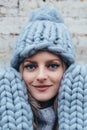 Blonde woman in blue knitted hat