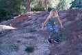 Young blonde woman in sportswear running cross-country in the mountains. Concept, running, trailrunning, fitness, exercise, curvy Royalty Free Stock Photo