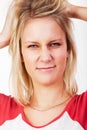 Young blonde woman tearing her hair Royalty Free Stock Photo