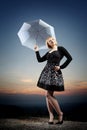 Young blonde woman with umbrella Royalty Free Stock Photo