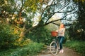 Young blonde woman on a vintage bicycle Royalty Free Stock Photo