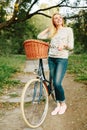 Young blonde woman on a vintage bicycle Royalty Free Stock Photo