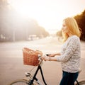 Young blonde woman on a vintage bicycle Royalty Free Stock Photo