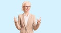 Young blonde woman wearing business clothes and glasses crazy and mad shouting and yelling with aggressive expression and arms Royalty Free Stock Photo