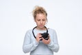 Young blonde woman is working in the photography studio Royalty Free Stock Photo