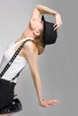 The young blondy girl with black hat Royalty Free Stock Photo
