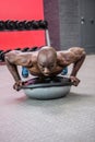 Young bodybuilder doing excercises Royalty Free Stock Photo