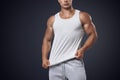 Young bodybuilder wearing white sleeveless t-shirt Royalty Free Stock Photo