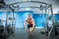 Young Bodybuilder Is Working On His Chest With Cable Crossover In Gym. Royalty Free Stock Photo