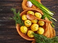 Young boiled potatoes, organic spring dill background, vegetarian garlic natural