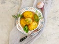 Young boiled potatoes, dill background, vegetarian garlic natural