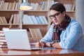 The young book writer writing in library