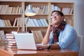 The young book writer writing in library Royalty Free Stock Photo