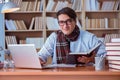 The young book writer writing in library Royalty Free Stock Photo