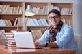 The young book writer writing in library