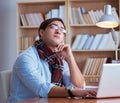 Young book writer writing in library Royalty Free Stock Photo