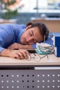 Young male bookkeeper in budget planning concept Royalty Free Stock Photo