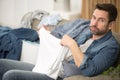 young bored man doing laundry Royalty Free Stock Photo